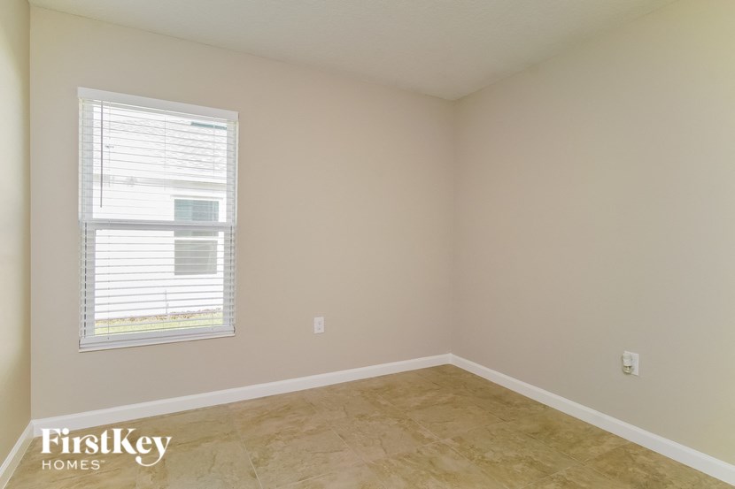 A room with a window and a FirstKey Homes logo.
