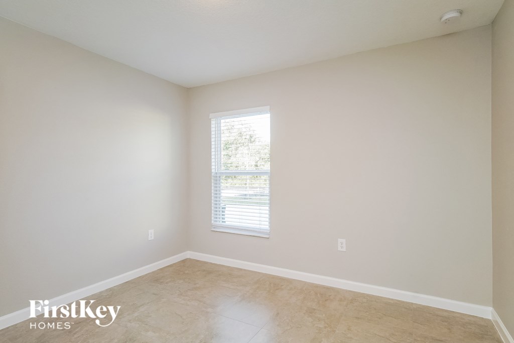 a empty room with white walls and a window