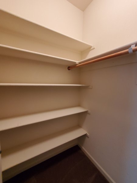Empty white shelves in a room.