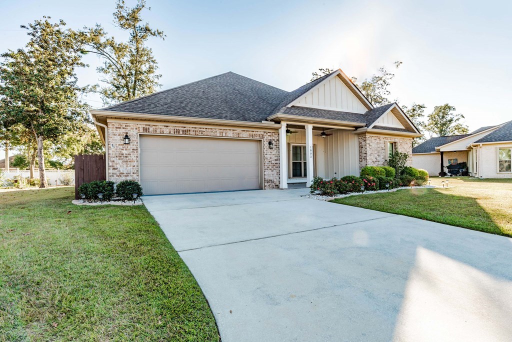 A house with a garage door that says "HOME".