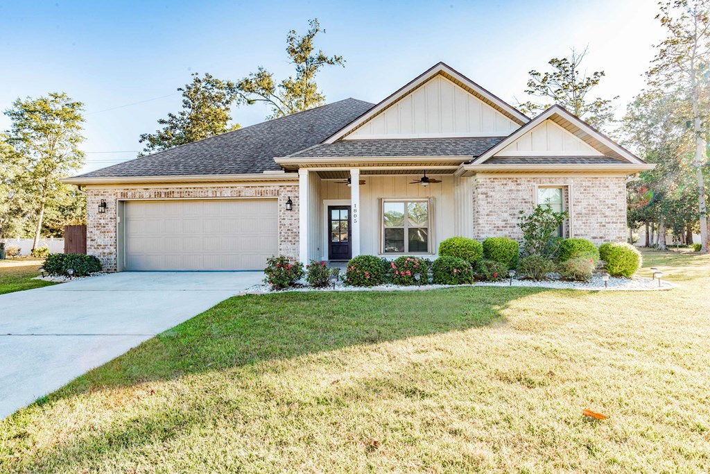 A house with a garage and a driveway.