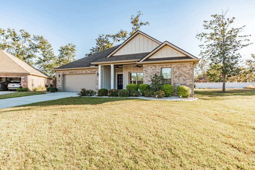 A house with a well-kept lawn in front.