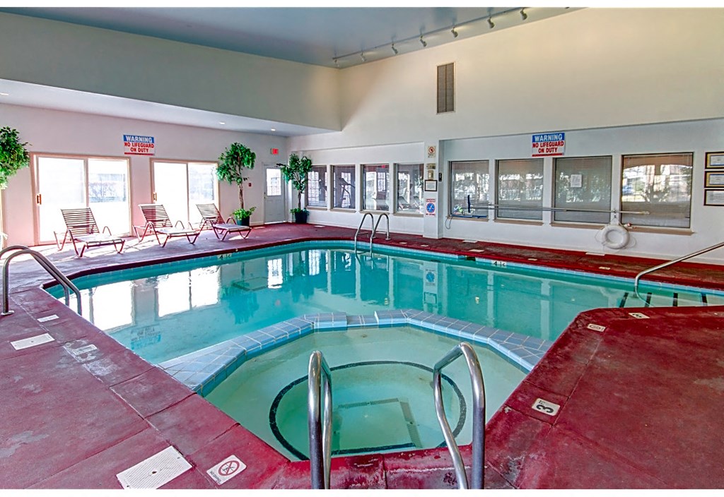 a swimming pool in a building with a pool