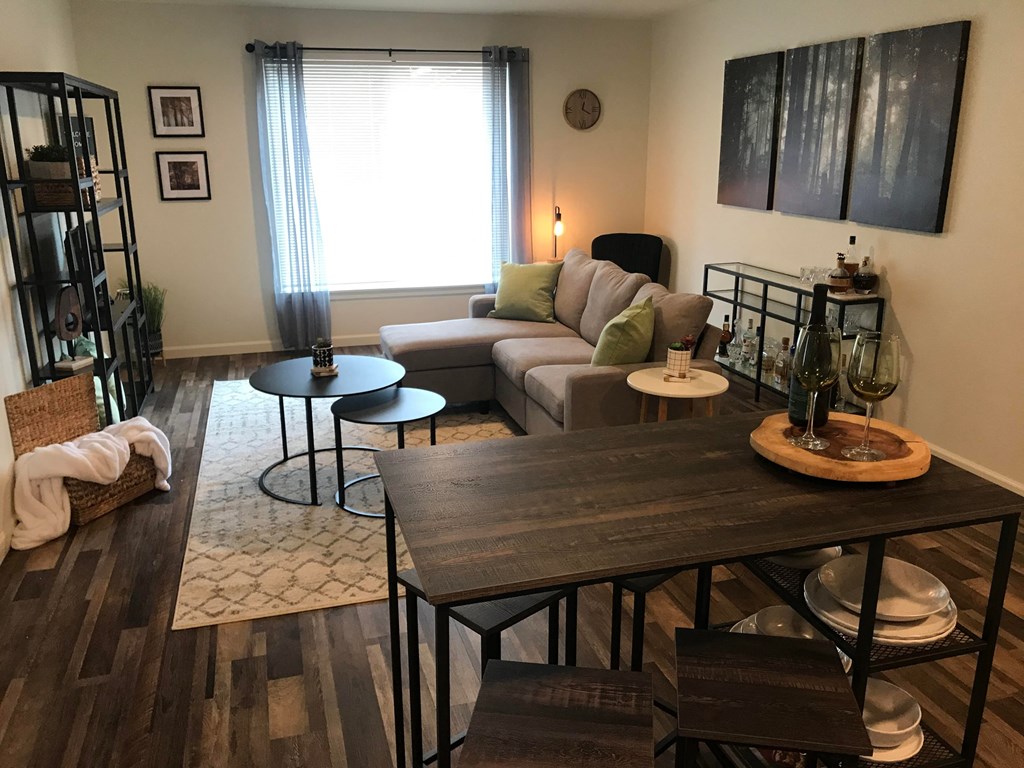 a living room with a dining room table and a couch