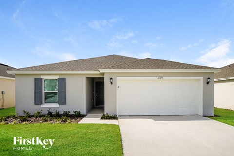 A house with a garage door that says FirstKey Homes.