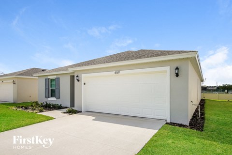 A house with a garage door numbered 69.