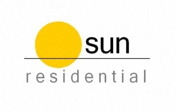 A logo with a yellow circle and the words "sun residential" in black.