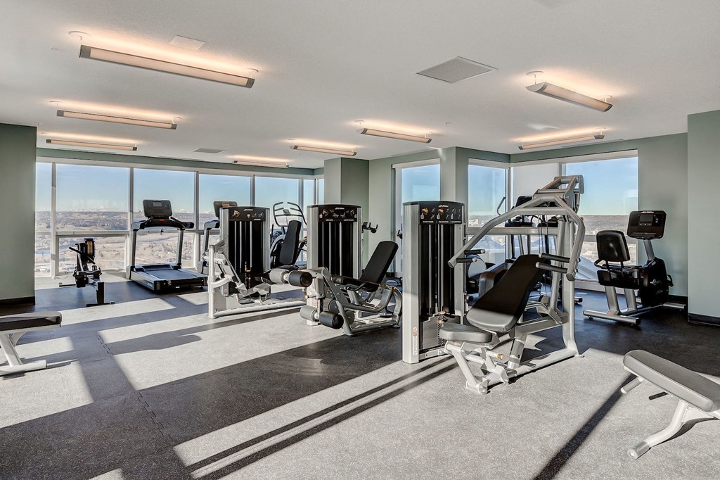 a gym with a view of the city