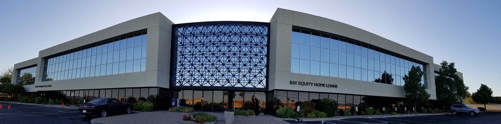 a view of the front of a building with glass windows