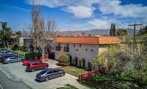 a house with cars parked in front of it