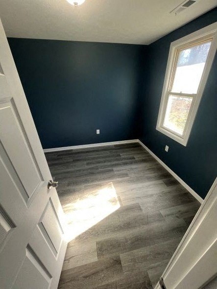 A room with a white door and a window.