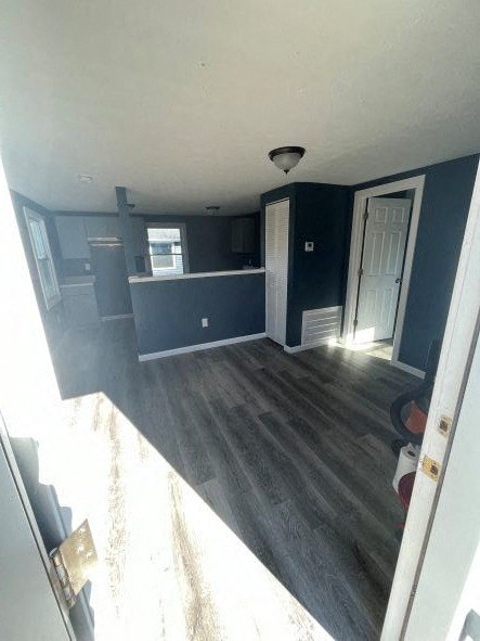 A room with a white door and a window.