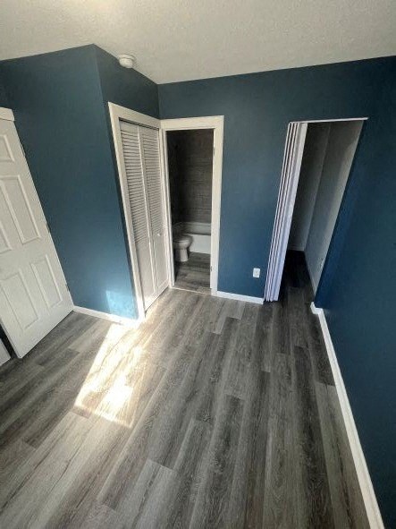 A room with a wooden floor and blue walls.