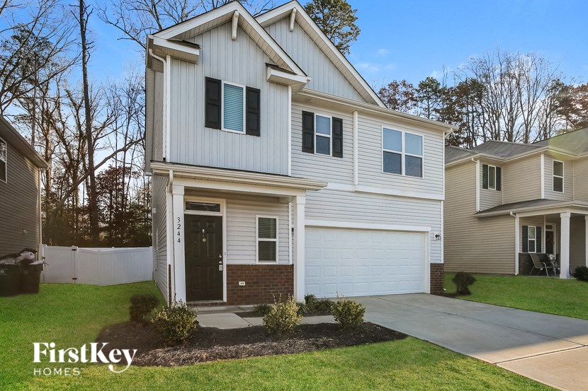 A house with a garage is for sale by FirstKey Homes.