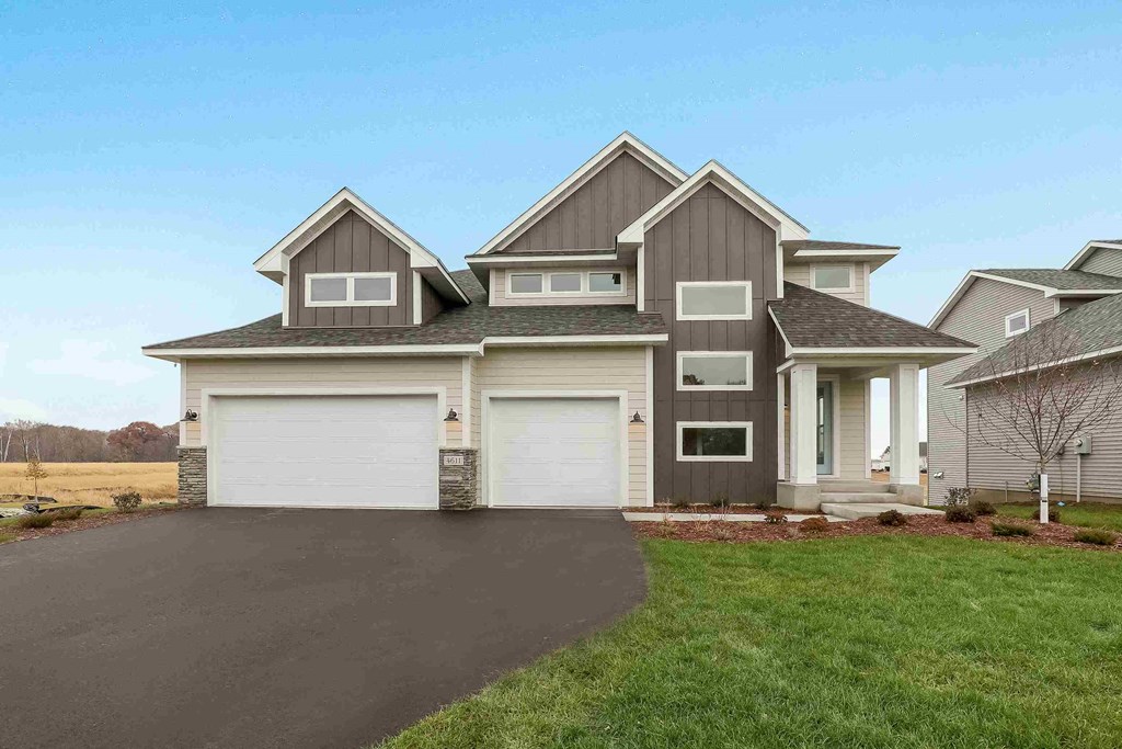 a large house with a driveway in front of it