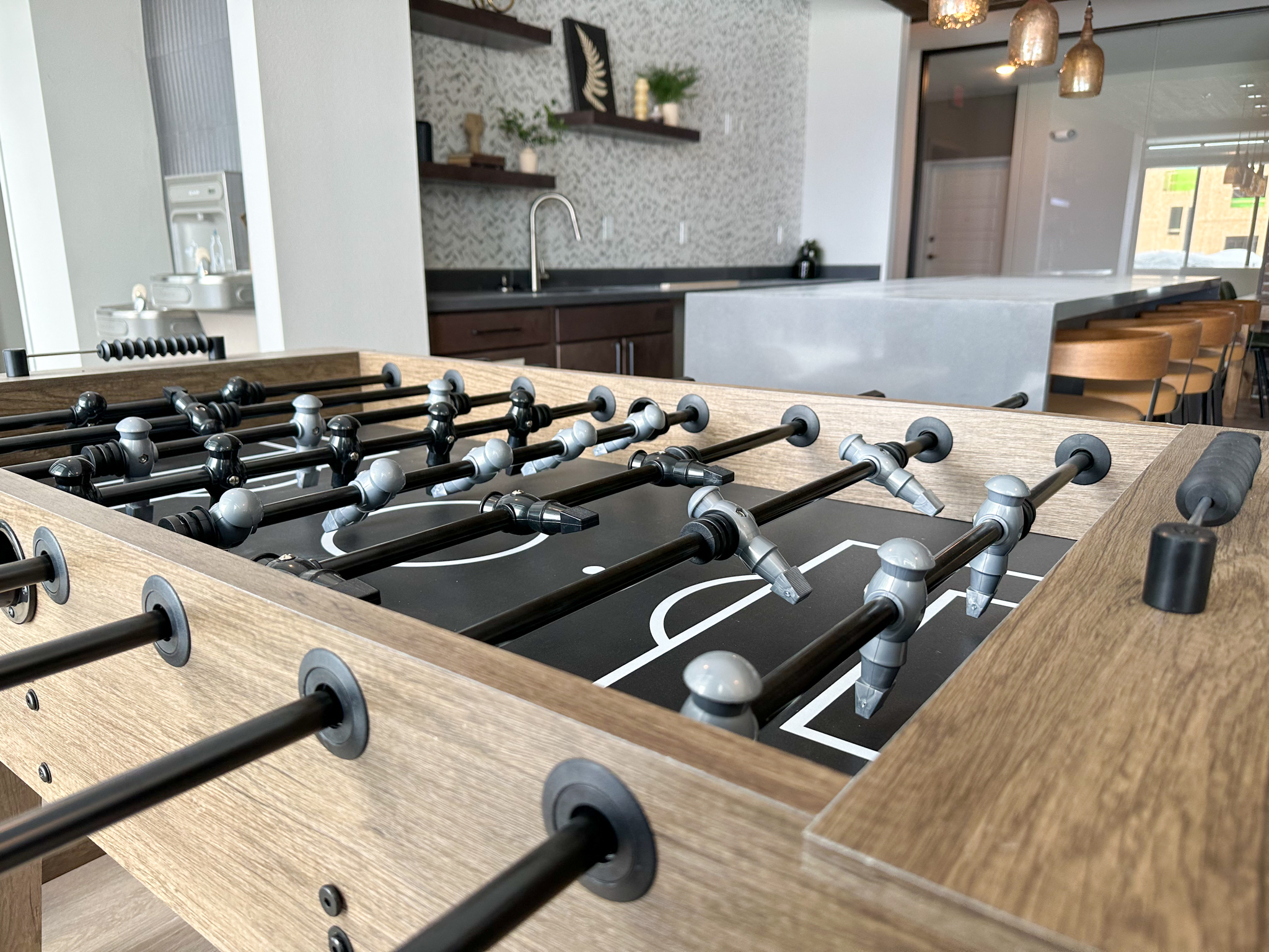 a large island in a kitchen with a stove top