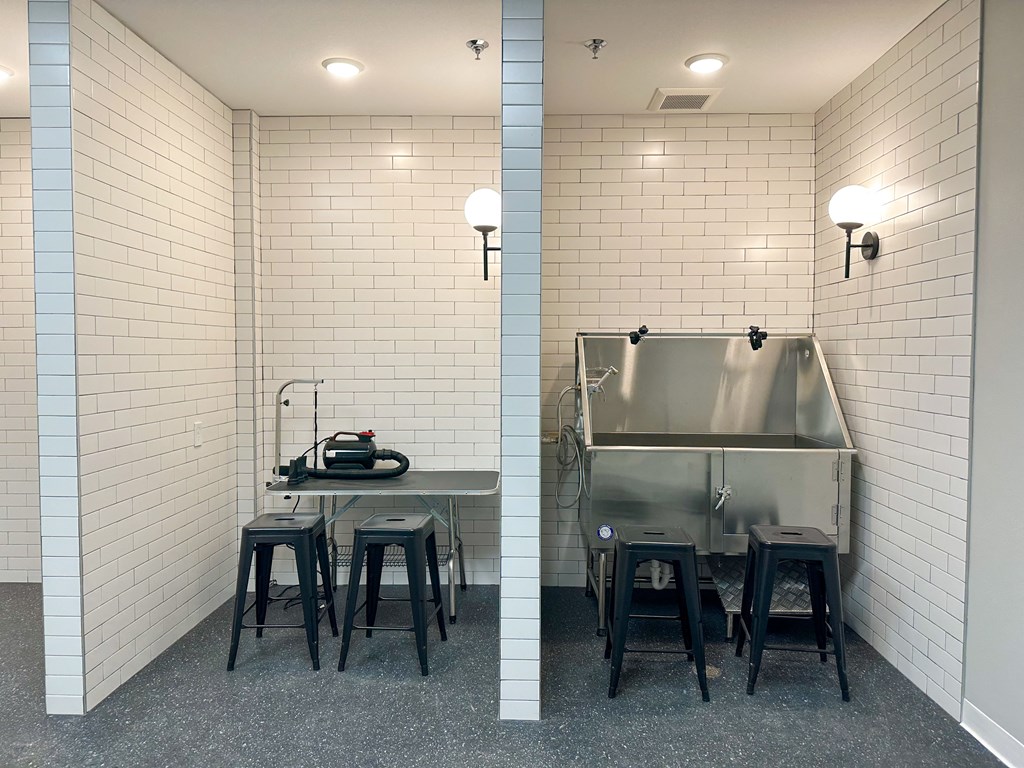 a kitchen with a sink and a table in a room