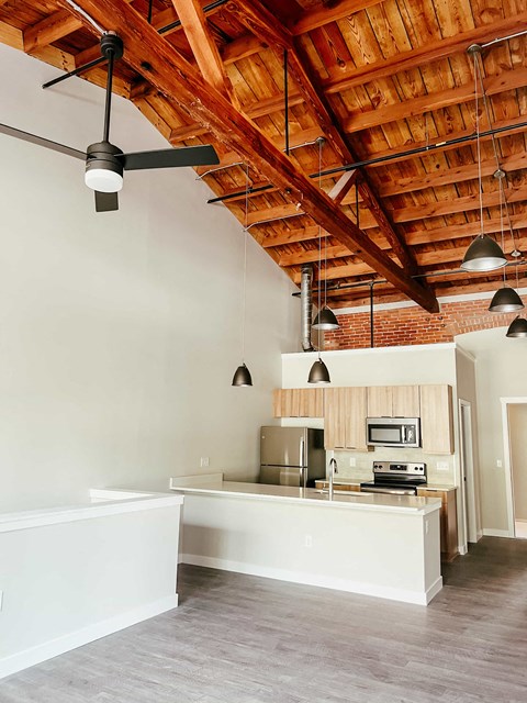a kitchen with white cabinets and a counter top