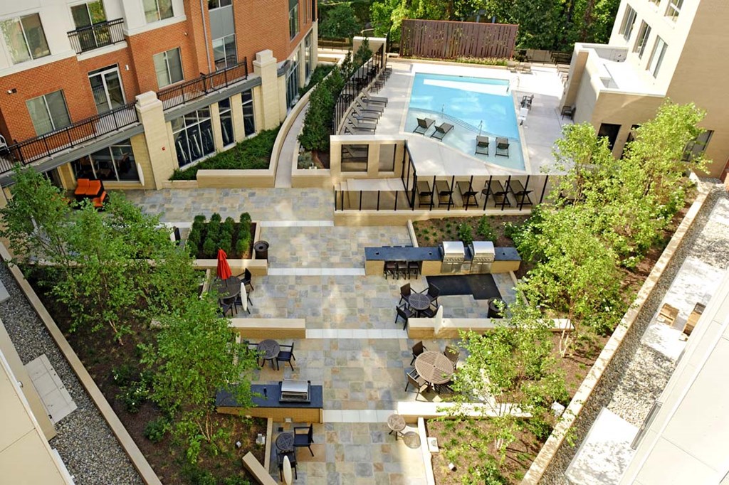 a view of the pool from the roof of a building