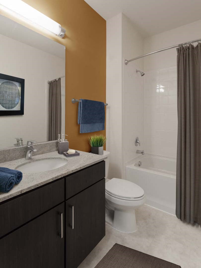 a bathroom with a sink toilet and a shower