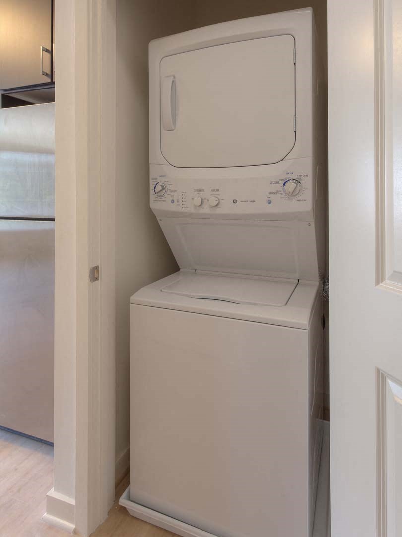 a white washer and dryer in a laundry room