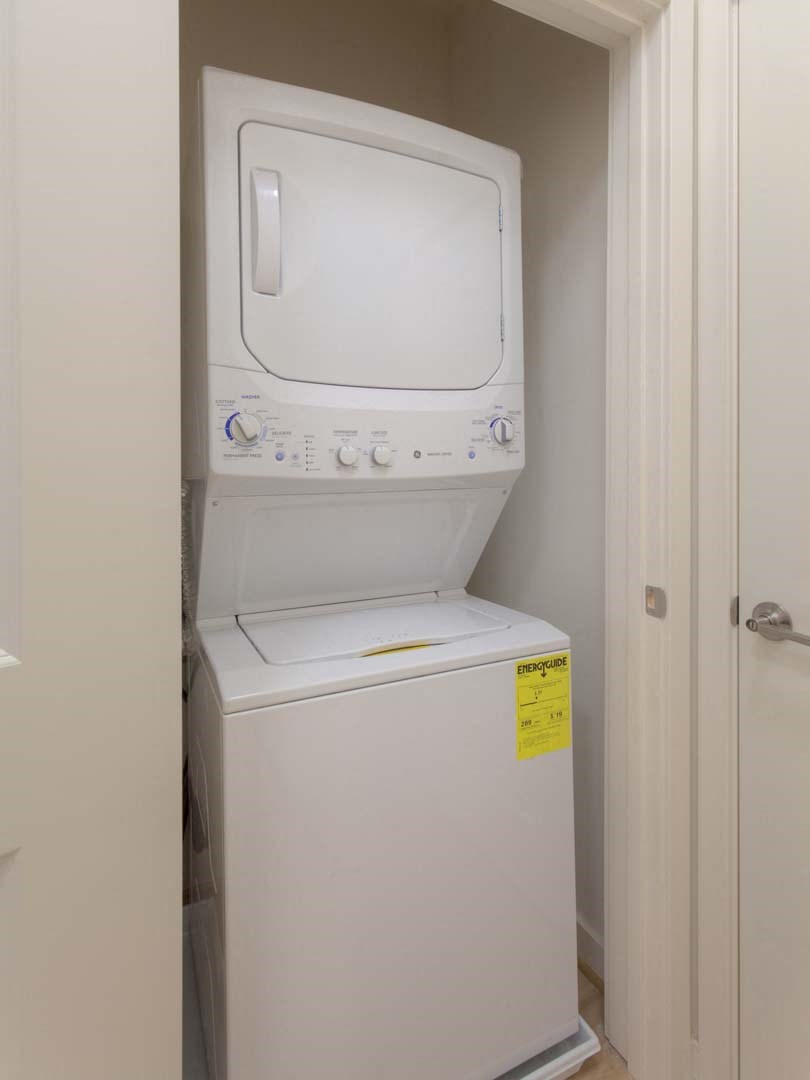 a white washer and dryer in a white room