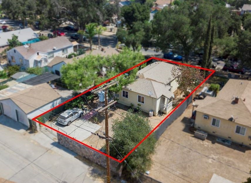 an aerial view of a house with a red line around it