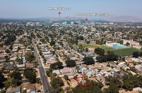 an aerial view of the city of down town riverside and a neighborhood with buildings