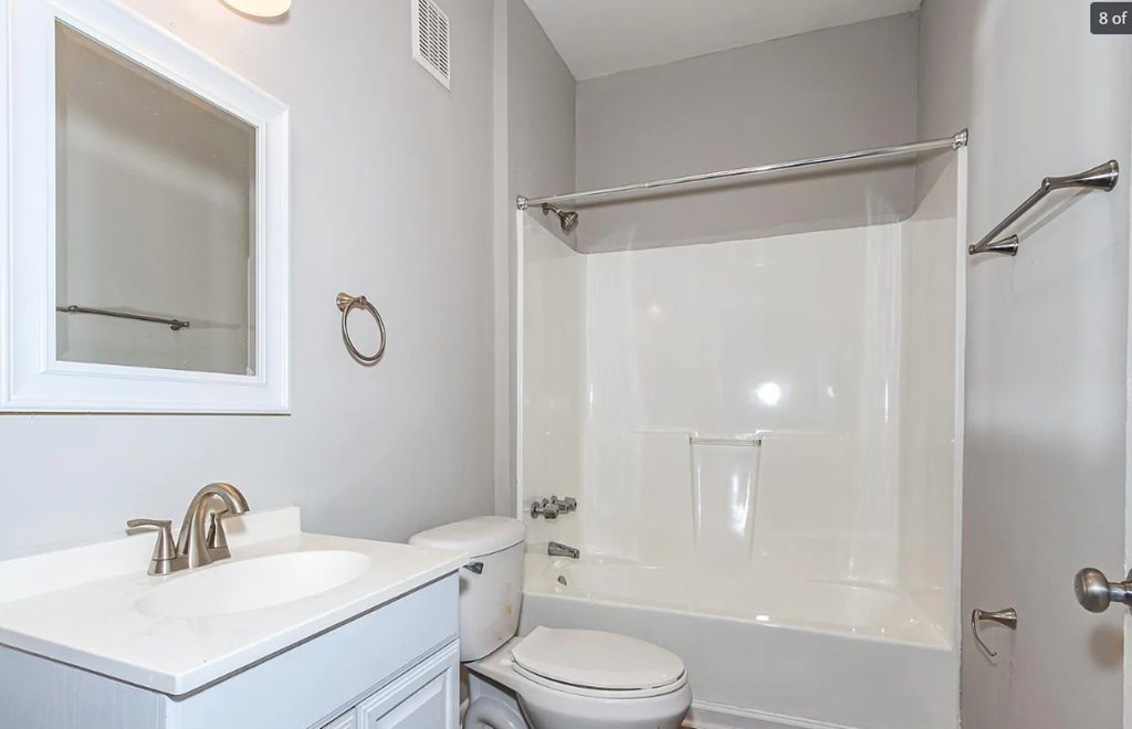 a bathroom with a sink toilet and a shower