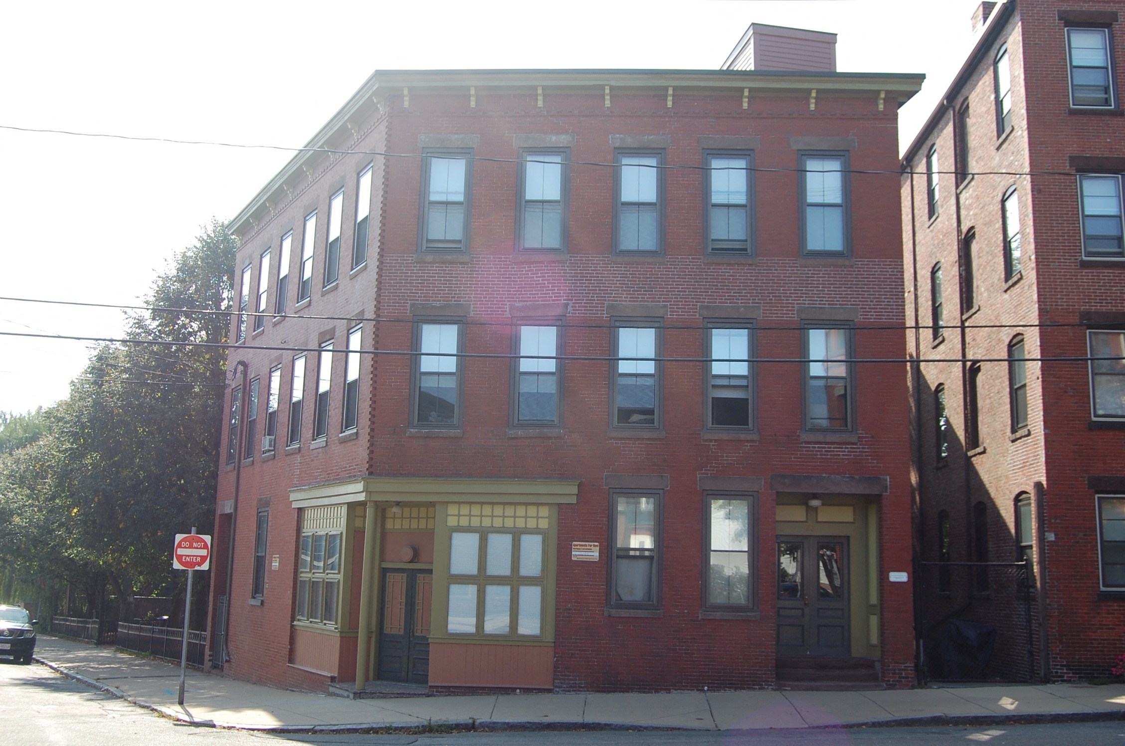 a red brick building on a city street