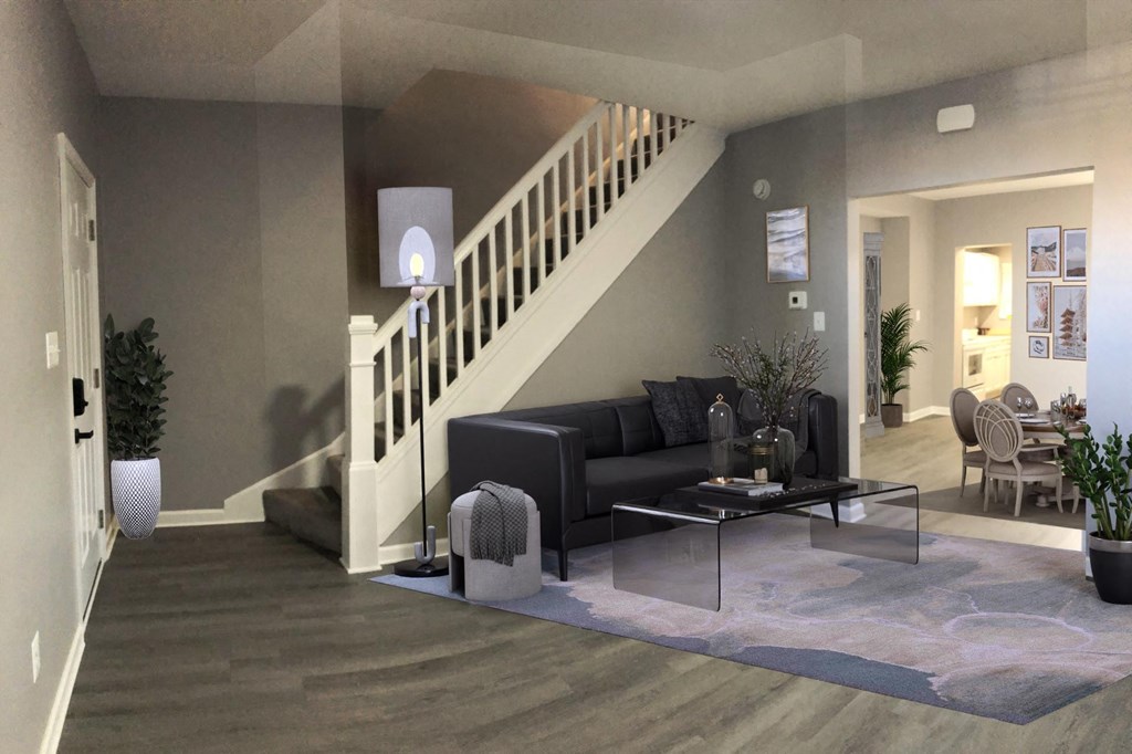 a living room with a staircase in a house