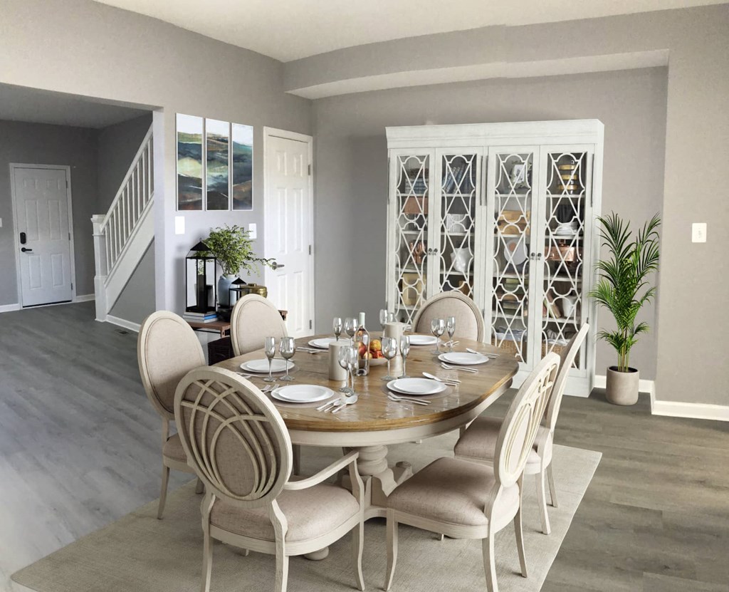 a dining room with a table and chairs