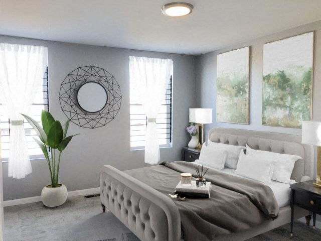 a bedroom with a bed and a mirror on the wall