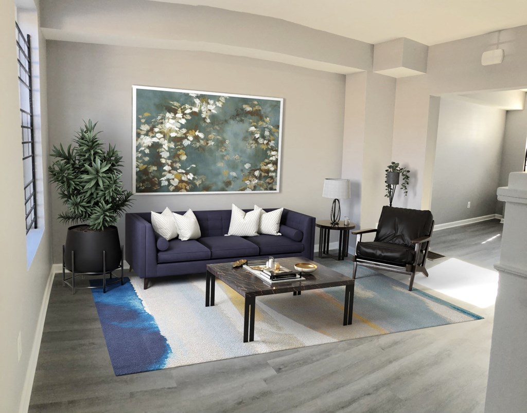 a living room with a purple couch and a coffee table