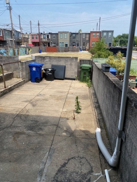 a plant growing out of the ground in a courtyard