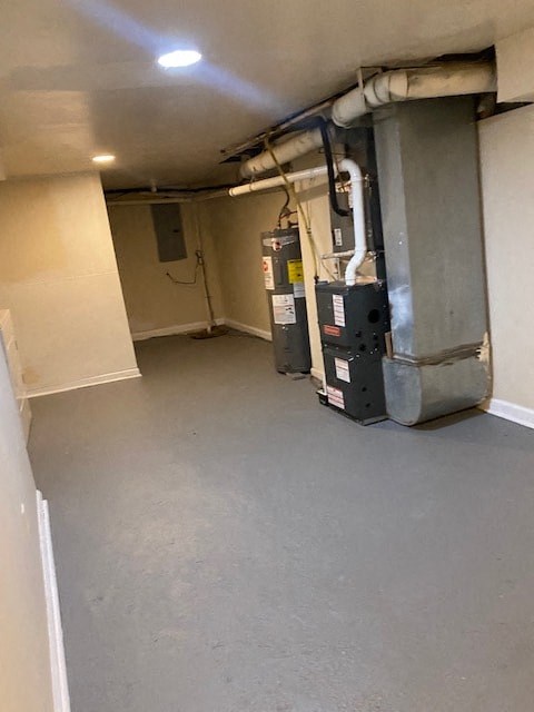 an empty basement with two machines in it