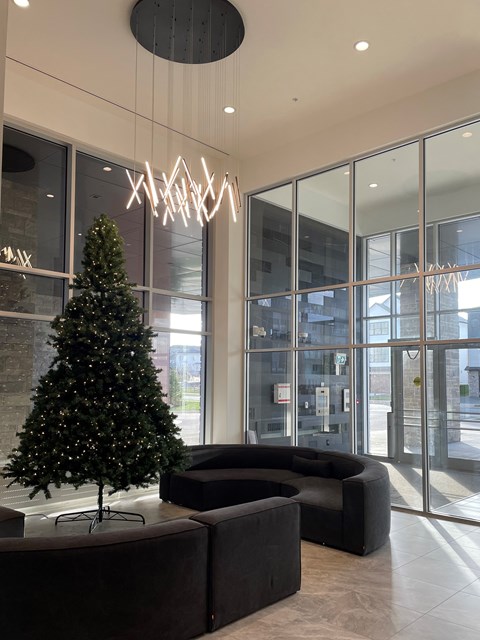 a christmas tree in the lobby of a building