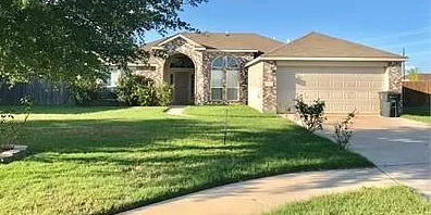 a house with a lawn in front of it