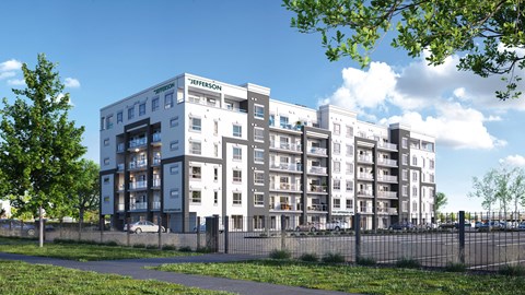 A Jefferson building with a fence and trees in front.