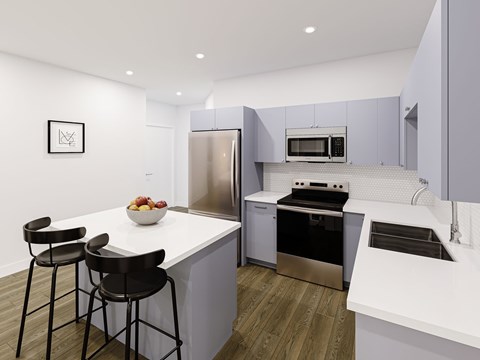 A modern kitchen with a white countertop and stainless steel appliances.