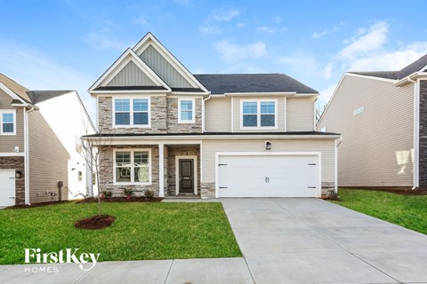 A house with a garage is for sale by FirstKey Homes.