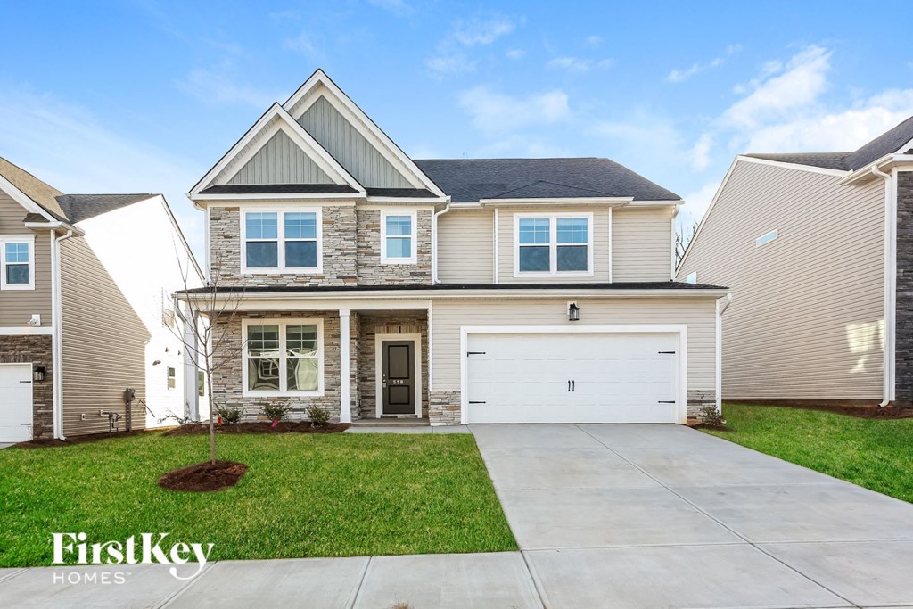 A house with a garage is for sale by FirstKey Homes.