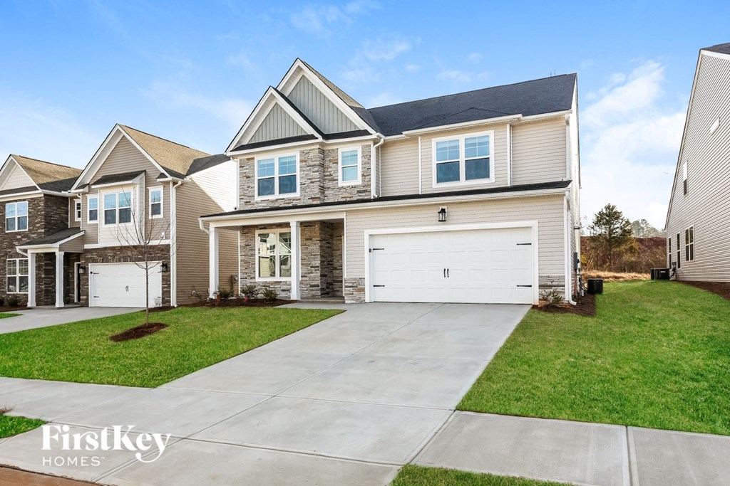 A house with a garage is for sale by FirstKey Homes.