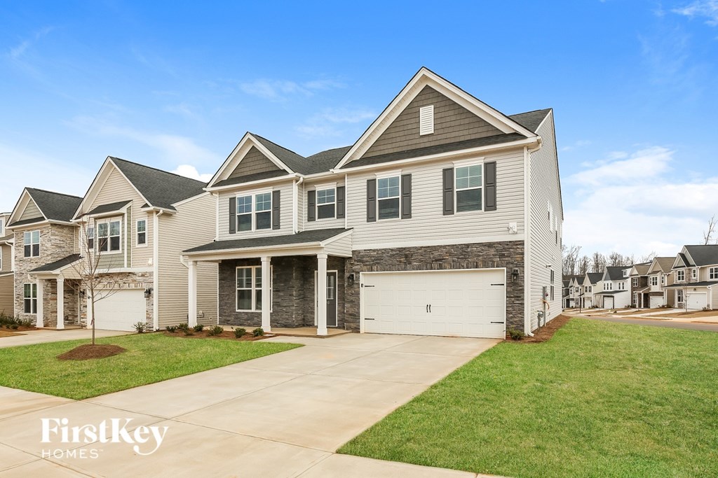 A large house with a garage is for sale.