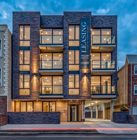 A modern building with the words "Leasing" on the front.