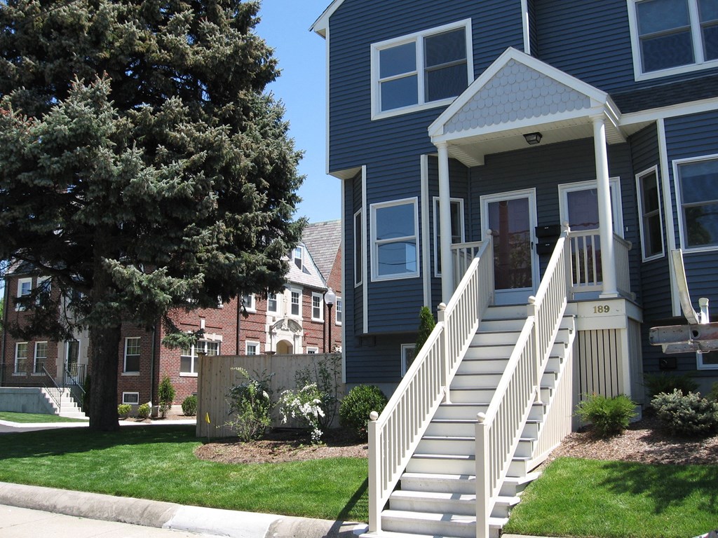 a row of houses with stairs in front of them