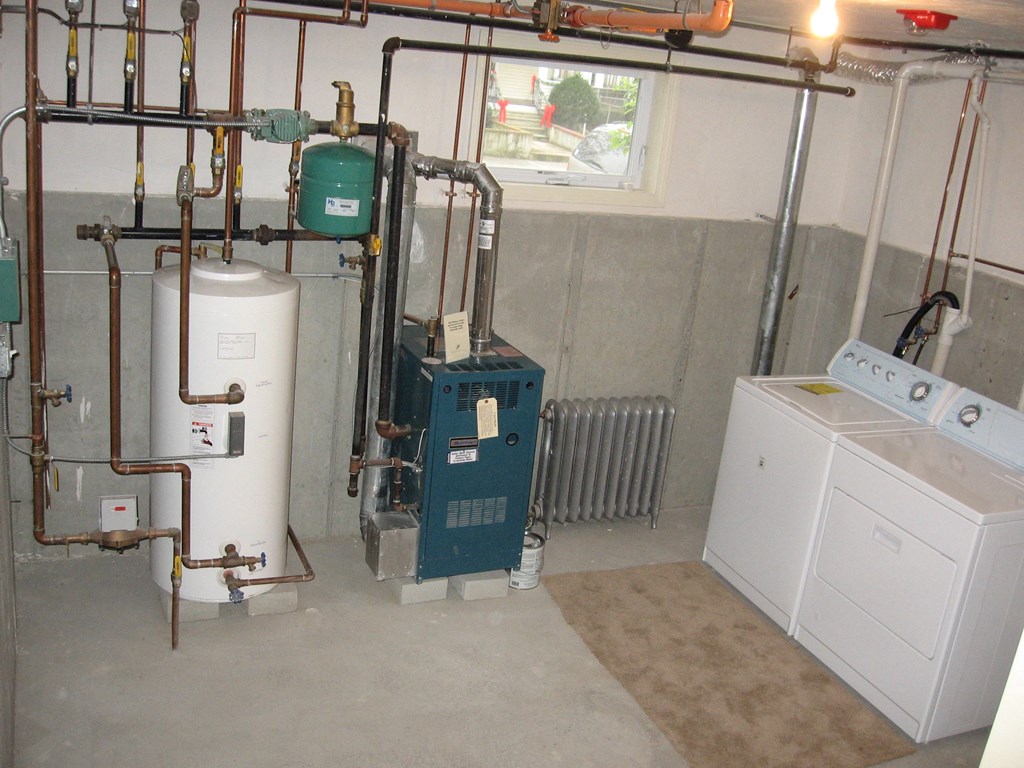 a view of the boiler room with the washer and dryer