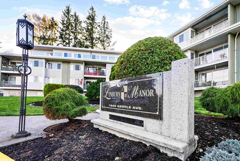 a sign is shown in front of an apartment building