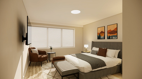 A modern bedroom with a large bed, a chair, a table, and a painting on the wall.