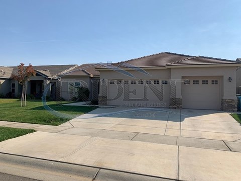 A house with a driveway in front of it.